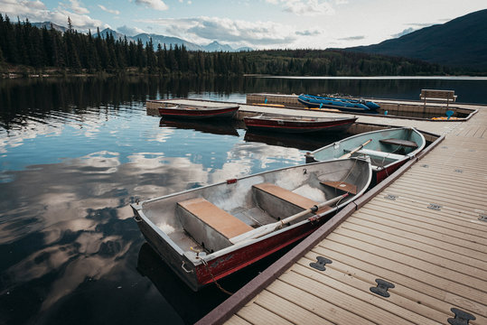 Rowboats tied up at a dock on Pyramid Lake, Jasper, Alberta, Canada.