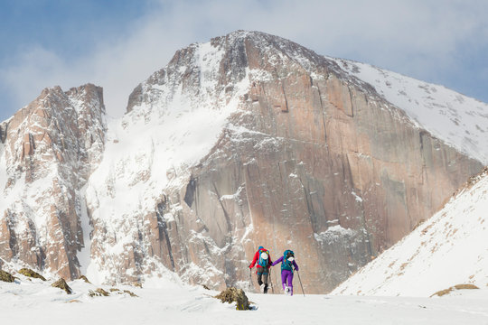 Climbers hike towards Longs Peak in Rocky Mountain National Park