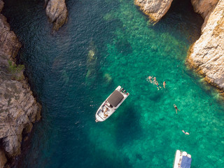 People swimming and enjoying a lagoon in Costa Brava, Spain