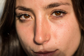 Beautiful brown eyes of a young girl