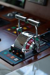 beautiful vertical shot of a shining metal yacht throttle