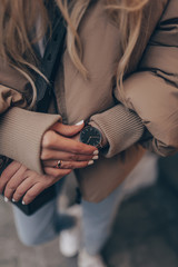 Elegant black watch on woman hand