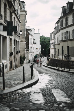 Fototapeta People walking in the streets of Paris in cloudy day