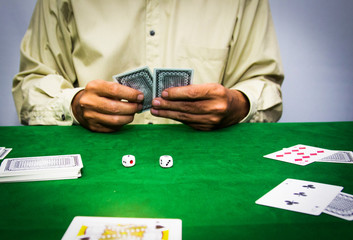 Casino equipment placed on the green floor for risky gambling for the people who want to get rich.