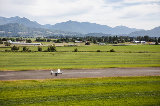 Aerial view of small plane taking off from rural airport in Chilliwack