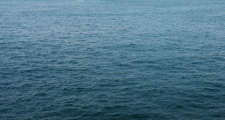 Dark blue ocean surface covered with waves