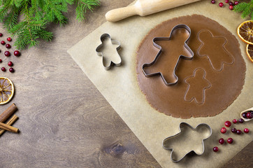 Baking christmas cookies on wooden table. Baking background