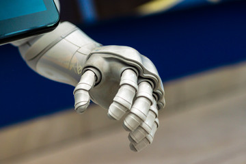 Robot arm of white color, close up