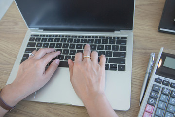 Fototapeta premium hands typing on laptop