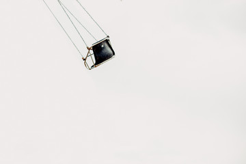 Lone swing on carnival ride