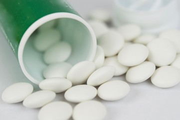 White pills and container