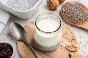 Yogurt and chia pudding in glass on table