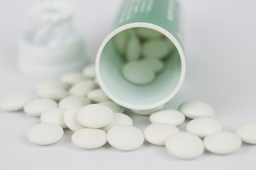 White pills and container