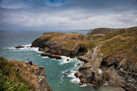 Two women looking out over the Cove of Titangel in Cornwall