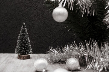 Fototapeta na wymiar Happy New Year and Christmas! Christmas tree, decorative little Christmas tree, Christmas white balls, decoration, on a wooden white table