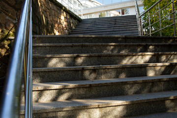stone staircase, iron railing, Sunny day, shadows from trees