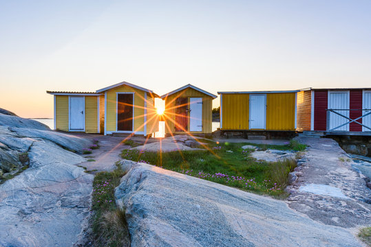 Boat huts at sunset