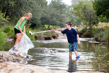 Siblings (6-7, 8-9) cleaning river