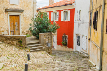 Fototapeta na wymiar Croatia, Istria, beautiful old cobbled street, traditional houses and in the old historical town of Motovun