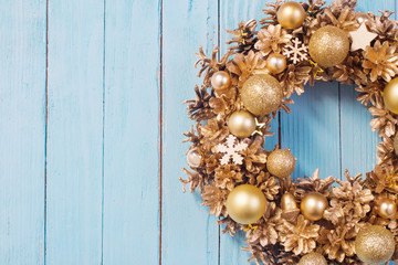 Christmas wreath on old blue  wooden background
