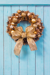Christmas wreath on old blue  wooden background