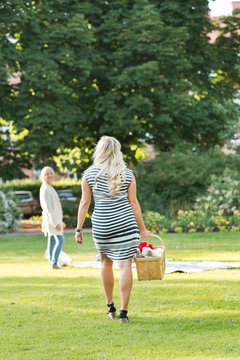 Woman carrying picnic basket