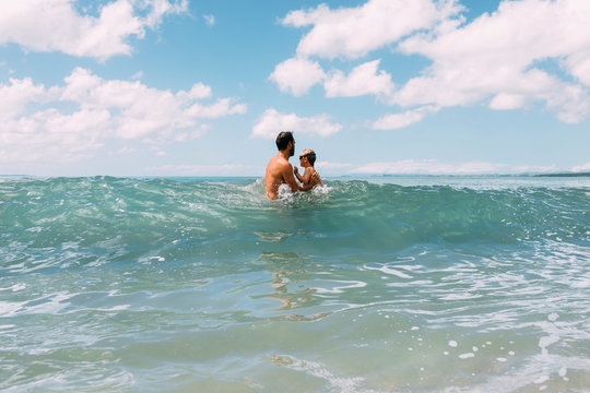 Father with child in sea