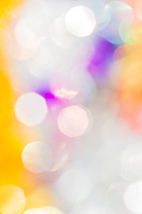 Festive background with multicolored glowing Christmas bokeh