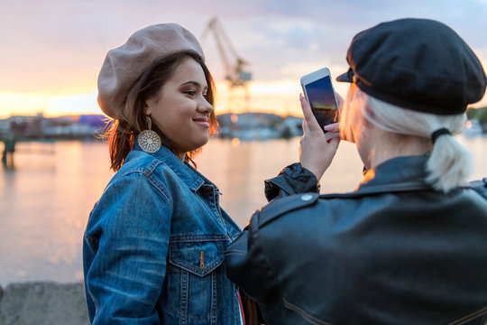 Teenage girls taking photos