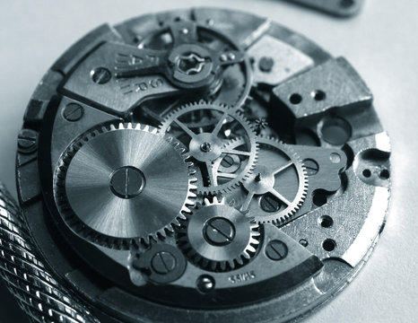 old mechanical watch mechanism, close up of small gears