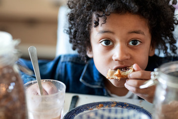 Portrait of boy eating