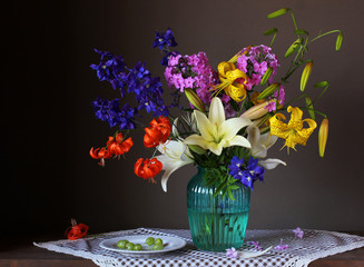 bouquet of garden flowers in a glass vase.