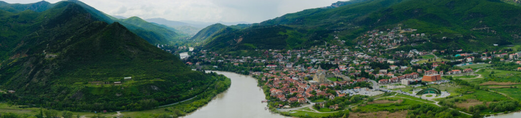 Fototapeta na wymiar panoramic top view of the Kura and Aragvi rivers and Mtskheta in Georgia on a summer day