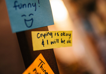 Affirmations stuck to the side of the mirror