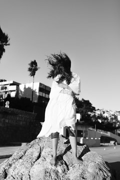 Fototapeta Black and white portrait of a girl during the sunset