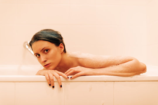 Young Androgyne Woman In Bath