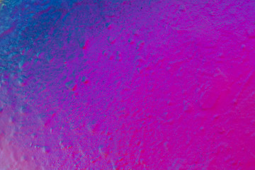 Obraz premium Beautiful bright colorful street art graffiti background. Abstract creative spray drawing fashion colors on the walls of the city. Urban Culture, pink, red, orange, , green, crimson, purple texture