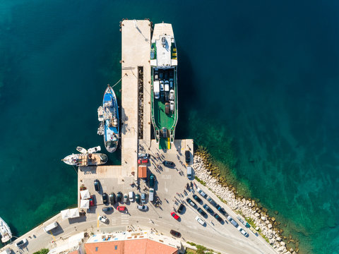 Aerial view of cars disembarking of a ferry, Sumartin, Croatia.
