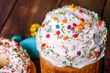 Easter cake and colorful eggs on a dark background