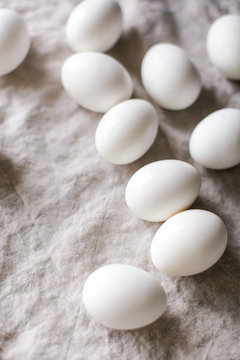White eggs on linen tablecloth