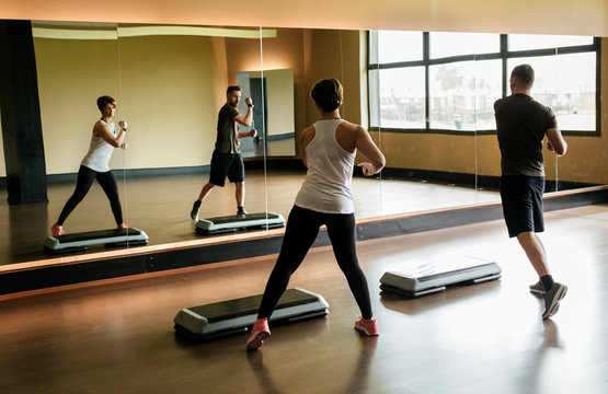 Couple practicing step indoors