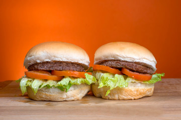 Take-Away foods on Orange vibrant background colour and wood
