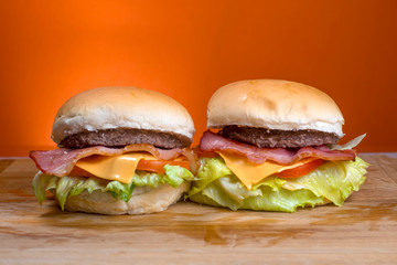 Take-Away foods on Orange vibrant background colour and wood