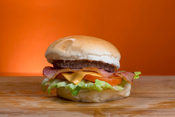 Take-Away foods on Orange vibrant background colour and wood