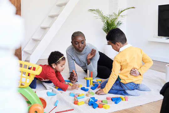 Black afro mother kids home.