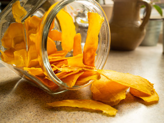 Orange dried mango fruit in the jar