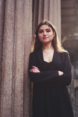 Fototapeta premium Model in black dress and long jacket. Style. Fashion trends 2020. Hair with ombre. Business lady. Blogger. Work