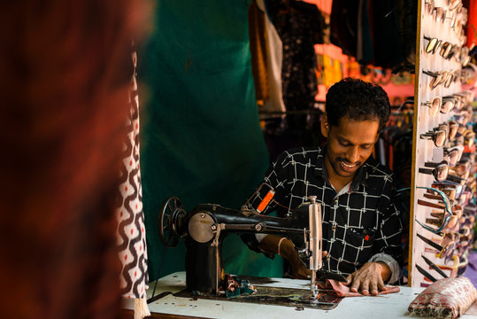 Ethnic tailor in workshop