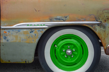 Vintage Car Side Panel with Bright Green Wheel