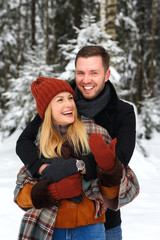 Obraz premium Couple in love, hugging, laughing heartily, love story